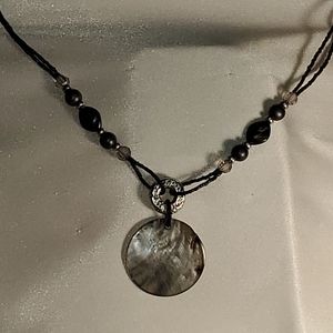 Black and silver toned beaded necklace w/ shell